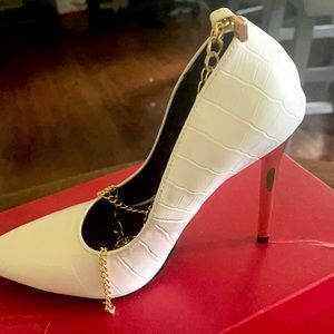 Brand new white heels with gold stems. Never worn